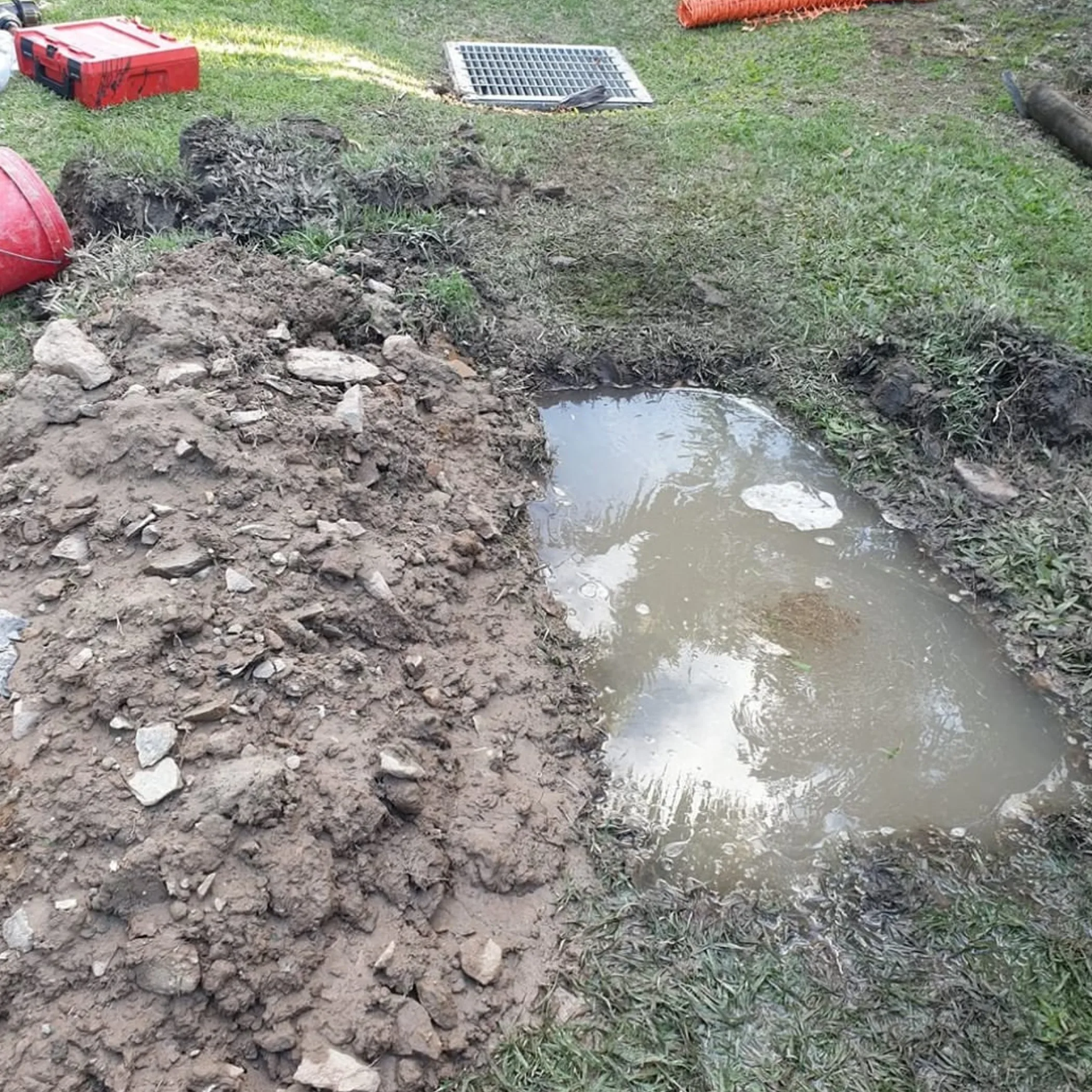standing water and exposed drainage work